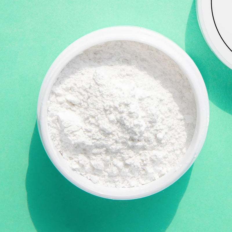 Diamond Smile tandblekningspulver PAP+ i ett provrör med grön bakgrund